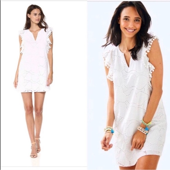 white dress with colorful pom poms